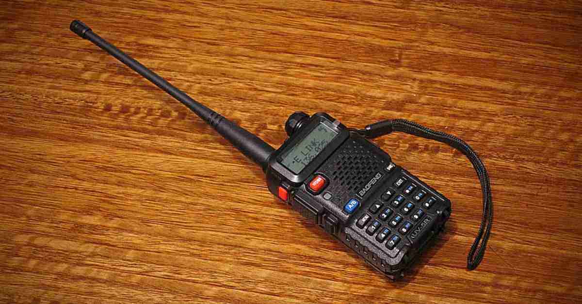 A picture of a hunting 2-way radio on a wood surface