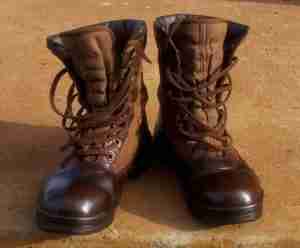 An image of a pair of hunting boots with a solid color design