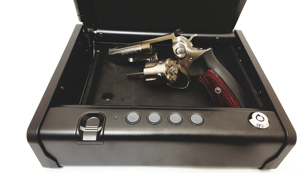 An image of gun safe with pistol in it